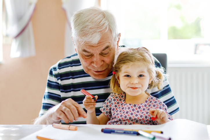 Elderly man with his granddaughter